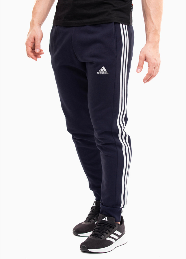 adidas Pánske tepláky Essentials French Terry Tapered Cuff 3-Stripes IC9406 adidas Pánske tepláky Essentials French Terry Tapered Cuff 3-Stripes IC9406