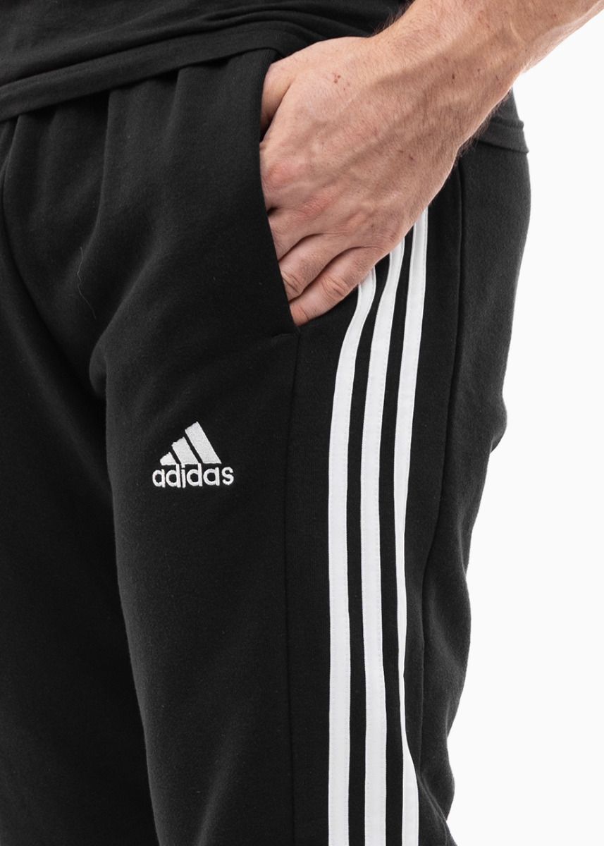 adidas Pánske nohavice Essentials FT Cuff 3-Stripes IC0050 adidas Pánske nohavice Essentials FT Cuff 3-Stripes IC0050