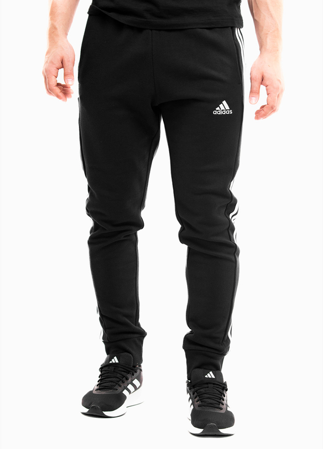 adidas Pánske tepláky Essentials French Terry Tapered Cuff 3-Stripes HA4337 adidas Pánske tepláky Essentials French Terry Tapered Cuff 3-Stripes HA4337