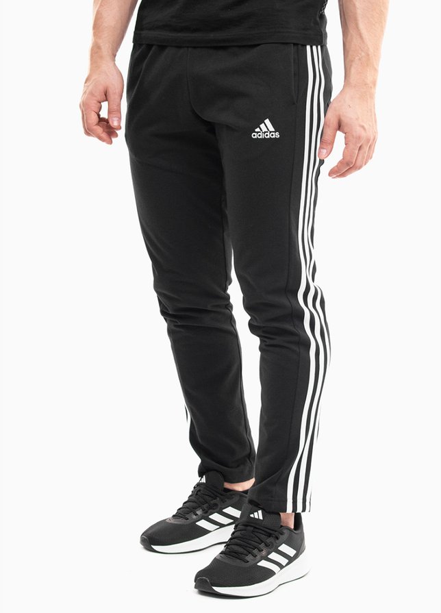 adidas Pánske tepláky Essentials Single Jersey Tapered Open Hem 3-Stripes IC0044 adidas Pánske tepláky Essentials Single Jersey Tapered Open Hem 3-Stripes IC0044